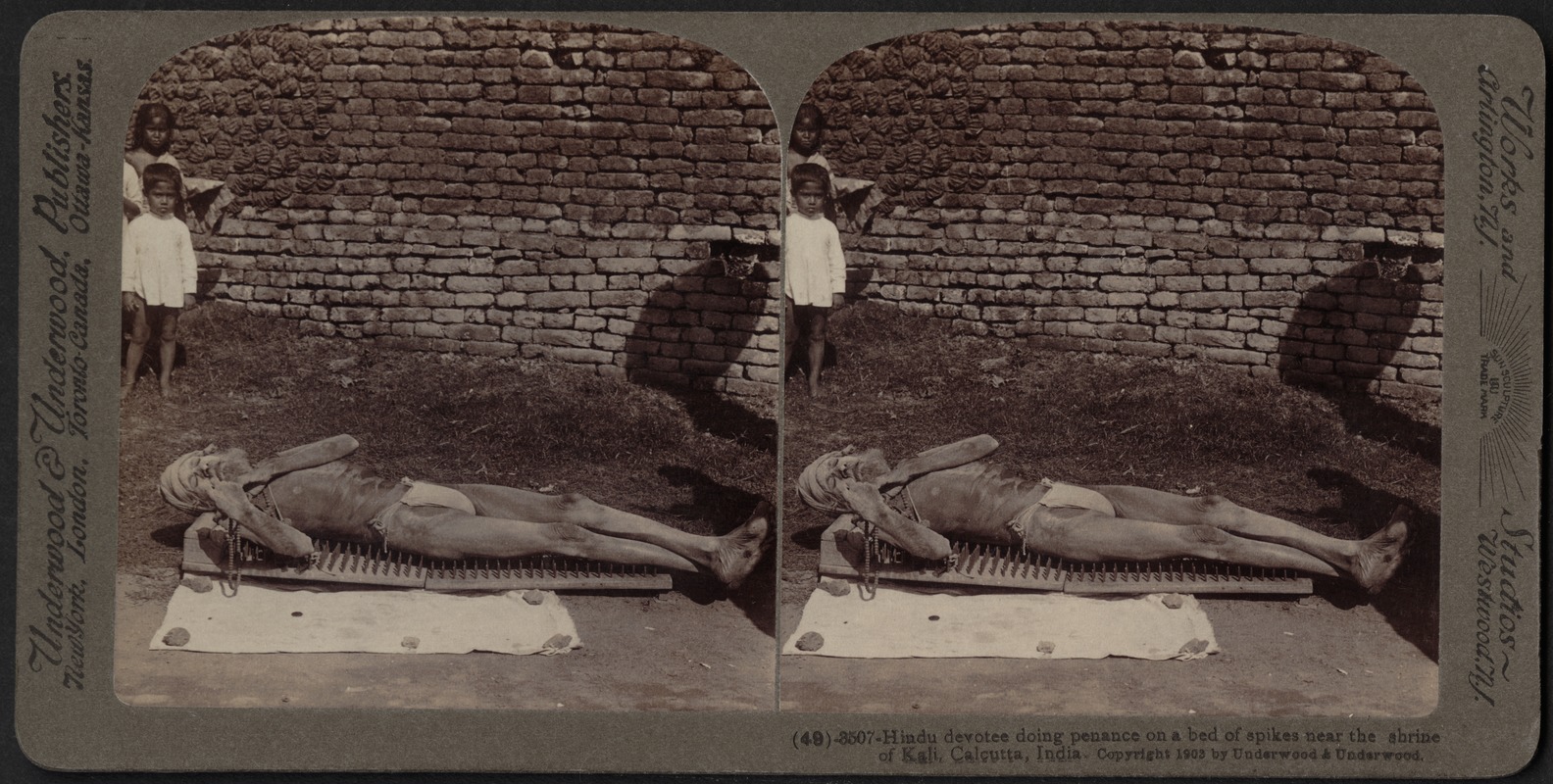 Hindu devotee doing penance on a bed of spikes, Calcutta, India