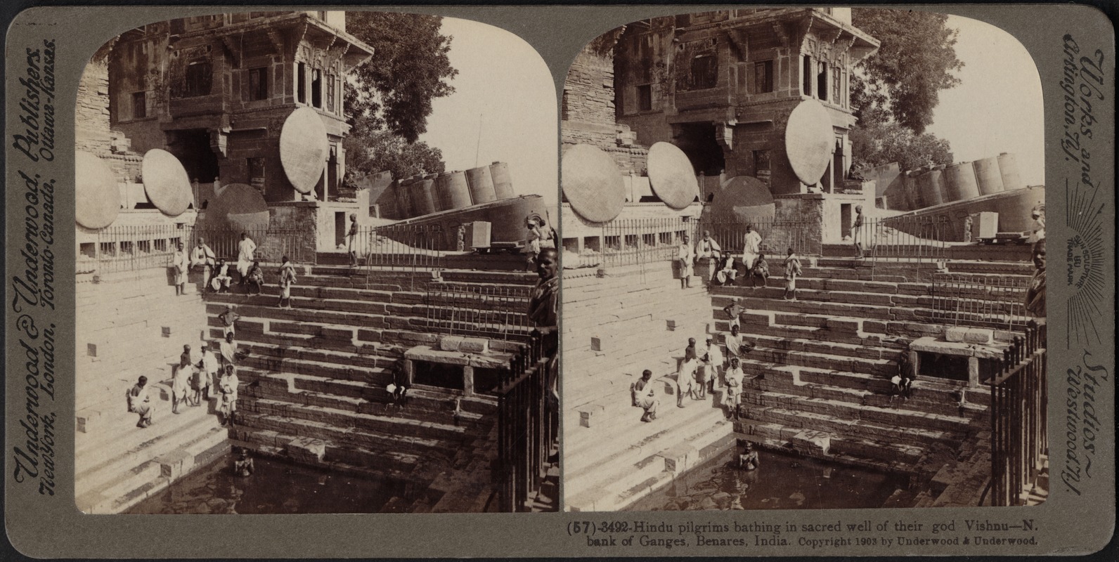 Hindu pilgrims bathing in the well of Vishnu, Benares, India
