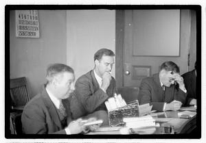 Group of men at table