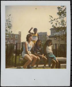 Group on a bench in Newtowne Court