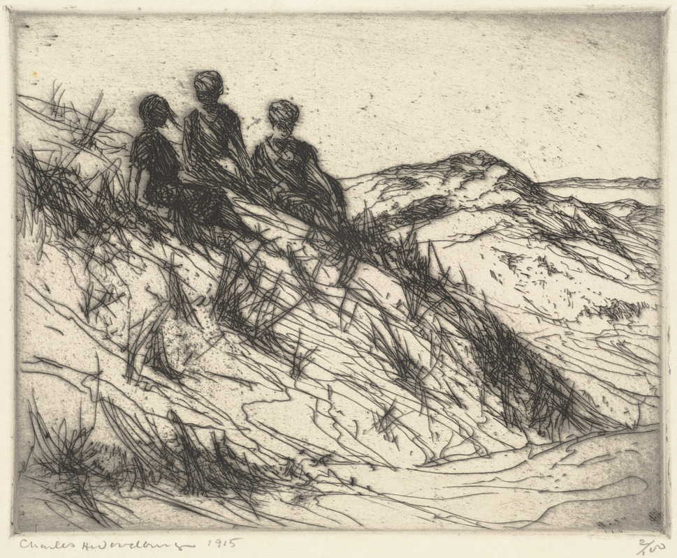 Three women seated on dunes