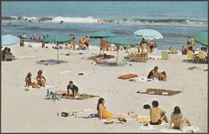 Sunbathers enjoying the sand and surf at Old Orchard Beach, Maine