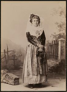 Studio portrait of woman in traditional Greek dress