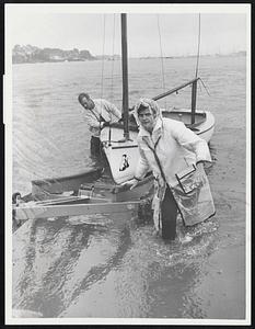 All for Naught was this soggy endeavour of Mr. and Mrs. Paul Woodfin of Marblehead as they hauled their boat in at the Causeway in Marblehead.