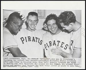 Pennant "Spoilers" -- Key men in Pittsburgh's 10-inning 2-1 victory over pennant-contending Milwaukee Braves celebrate after game today in dressing room. From left, Roberto Clemente who drove in winning run; Bill Mazeroski who scored it; Bob Friend, who pitched fourhitter and Catcher Jack Shepard who made vital putout at plate to save run.