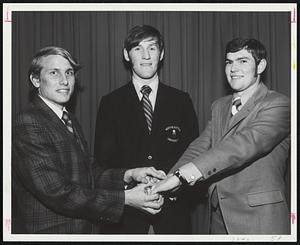 Northeastern Winter Captains (from left) Tom Wittenhagen, track; Kevin Shea, basketball, and John Boyce, hockey, congratulate each other.