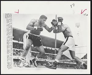 Patterson's a Winner in Sweden--A Floyd Patterson left leads to a coverup by Eddie Machen in first round in their Stockholm match today. Patterson, one-time heavyweight champ, won on a decision.