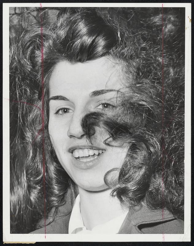 Windblown Bob is no misnomer for Santina Peluso's coiffure as the pretty Winthrop girl lets her locks fly in the wind downtown yesterday.