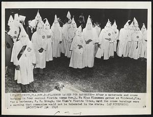Klansmen Gather for Barbeque--After a motorcade and cross burning in four central Florida town Nov. 1, Ku Klux Klansmen gather at Wildwood, Fla. for a barbecue. W.H. Brough, the Klan's Florida Titan, said the cross burnings were a warning that communism would not be tolerated in the state.