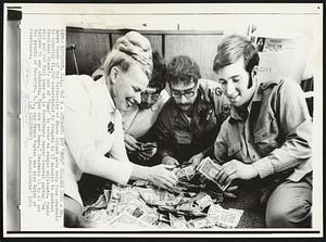 Students Not "Bums" College Says - Dr. Agnes Doody of the University of Rhode Island gets help from students in counting $1,200 contributed by faculty in 15 minutes to protest President Nixon's use of "bums" to refer to campus militants. Funds will pay for full page ad in Providence Sunday Journal saying "We believe in our students. They are not bums." Students (l to r) are Hal Krantz of Brooklyn, N.Y., and Bruce Kaplan and Alan Kritz of Providence.