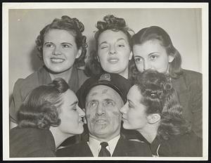 Nice Work if You Can Get it. Policeman Francis McCarthy looks as though he's enjoying his duty, surrounded by five contestants in cosmetics convention's search for loveliest lips in New England. Around the circle, starting at left front: Marjorie Glidden, Evelyn Kenny, Ruth Allen, Marjorie Kemp, and Margaret Horst. These girls are among nominees for convention finals next month.