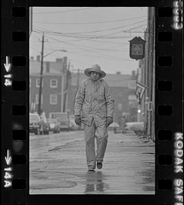 Man on Middle Street in rain gear