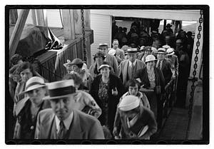 Passengers getting on a ship
