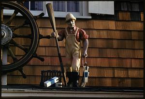 Figure of fisherman holding buoy and oar, Rockport, Massachusetts