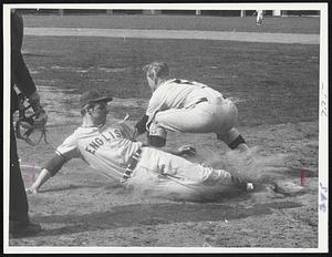 Beating the Throw is Lynn English's Doug Anderson, who slides safely under Peabody catcher Don Howard for one of four Lynn English's runs.