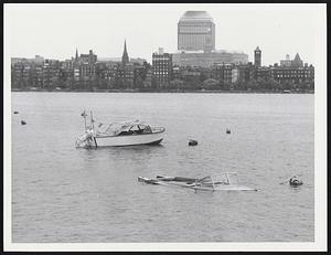 Boat sinking in the Charles River Memorial Dr. near Longfellow Bridge Camb.
