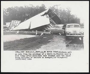 No Movie Today -- Workers pull an auto from the wreckage of a Drive-In-Theatre near here today after hurricane Ione slammed into the coast doing millions of dollars in damage.