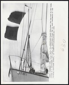 Hurricane Flag Fly -- Over the bow and in the background of a dry-docked sail boat, the hurricane flags fly to warn residents of the oncoming hurricane Esther.