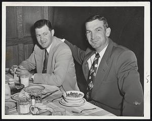 Infield and Outfield of the Detroit Tigers who are meeting the Red Sox in the second game of their series at Fenway Park today are represented by Infielder Connie Berry (left) and Outfielder Pat Mullin, brunching at the Kenmore.