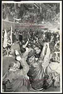 Telephone Co. Franklin St. Main building - Protestors sit on floor main entrance - giving clenched fists -