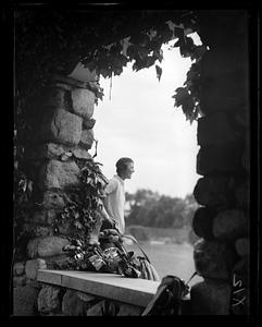 Golfer seen through a arch