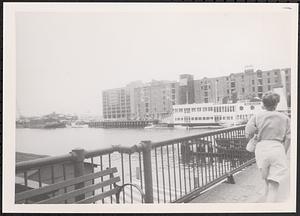 Woman walking over a bridge