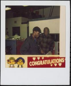 Two men grabbing food