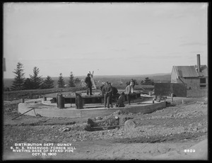 Distribution Department, Southern High Service Forbes Hill Reservoir, riveting the base of Standpipe, Quincy, Mass., Oct. 19, 1900
