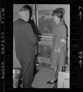 William Perkins, chief of the engineering division of the Veterans Hospital, Jamaica Plain, shows Representative Margaret Heckler some new aluminum siding engineers will install in the hospital walls to reflect heat from radiators