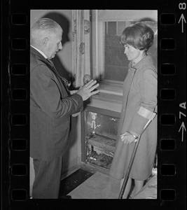 William Perkins, chief of the engineering division of the Veterans Hospital, Jamaica Plain, shows Representative Margaret Heckler some new aluminum siding engineers will install in the hospital walls to reflect heat from radiators