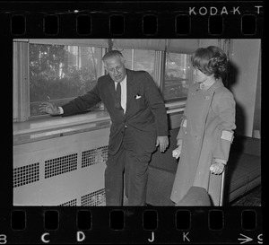 William Perkins, chief of the engineering division of the Veterans Hospital, Jamaica Plain, shows Representative Margaret Heckler some new aluminum siding engineers will install in the hospital walls to reflect heat from radiators