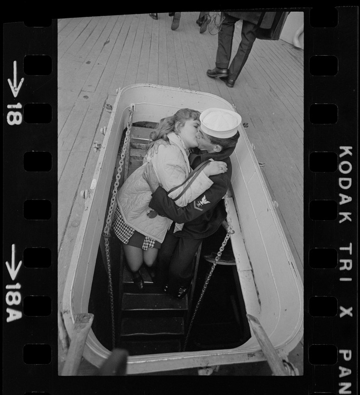 Families and sailors reuniting upon arrival of U. S. S. Boston at South Boston Naval Annex