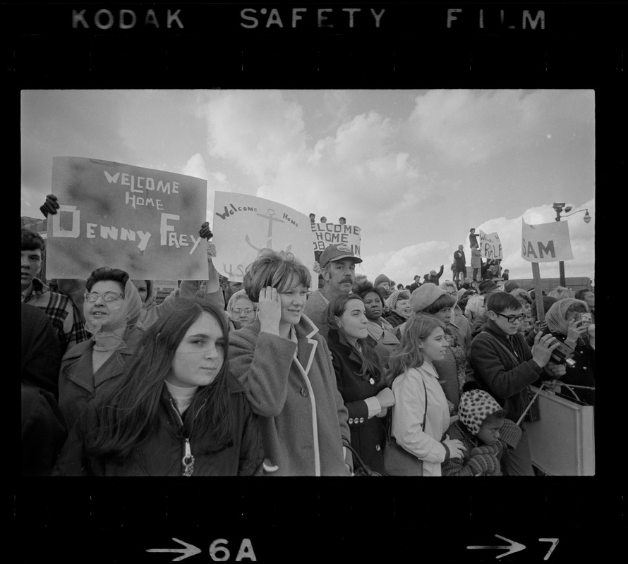 Families and sailors reuniting upon arrival of U. S. S. Boston at South Boston Naval Annex