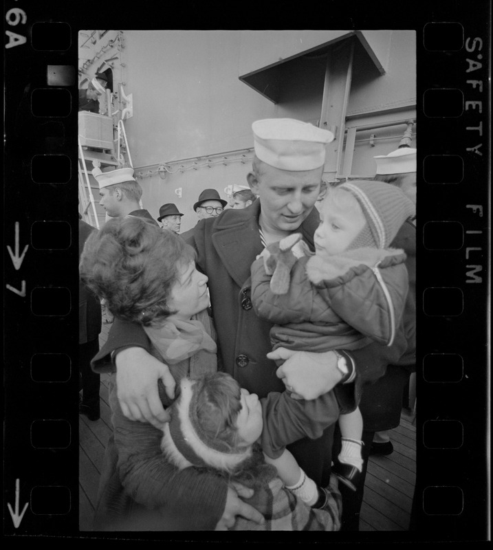 Families and sailors reuniting upon arrival of U. S. S. Boston at South Boston Naval Annex