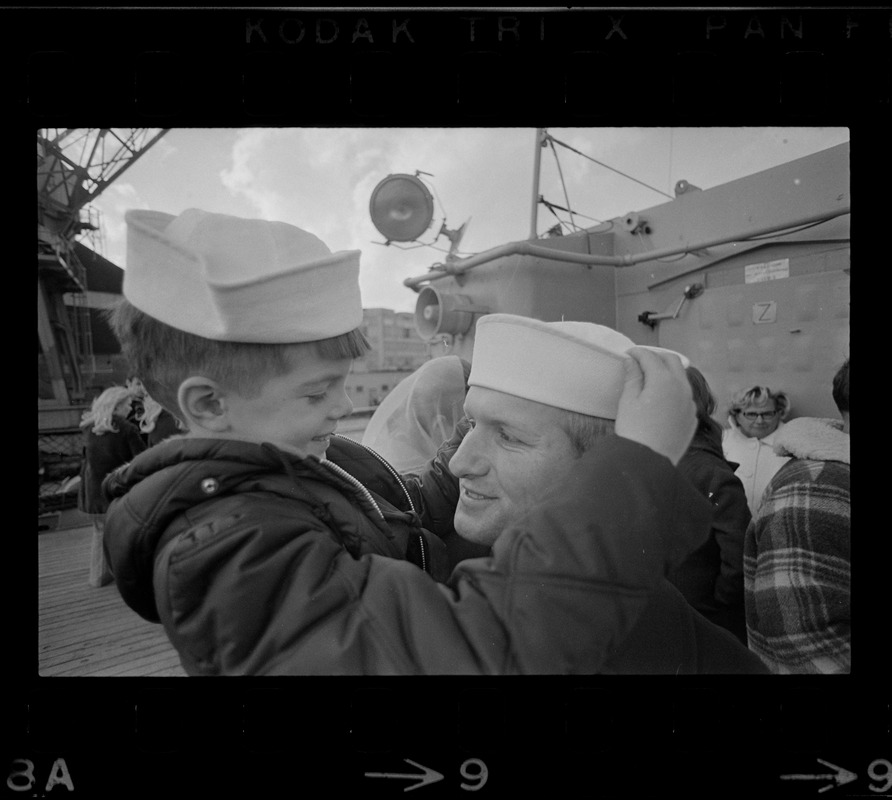 Families and sailors reuniting upon arrival of U. S. S. Boston at South Boston Naval Annex