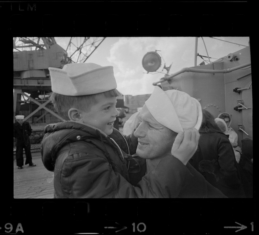 Families and sailors reuniting upon arrival of U. S. S. Boston at South Boston Naval Annex