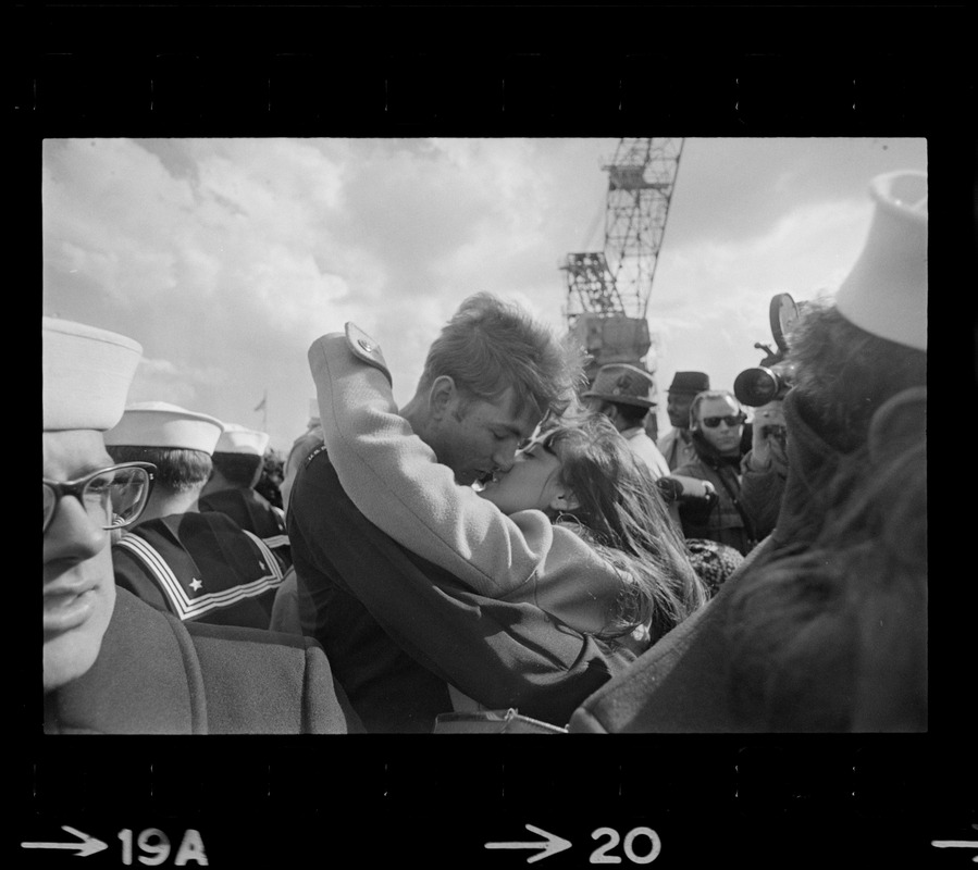 Families and sailors reuniting upon arrival of U. S. S. Boston at South Boston Naval Annex