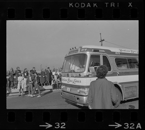 Bus carrying draftees passing anti-war protest at Boston Army Base