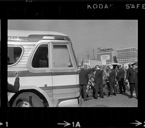 Bus carrying draftees passing anti-war protest at Boston Army Base