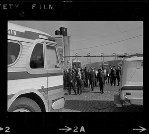 Bus carrying draftees passing anti-war protest at Boston Army Base