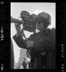 Cameraman at anti-war protest at Boston Army Base