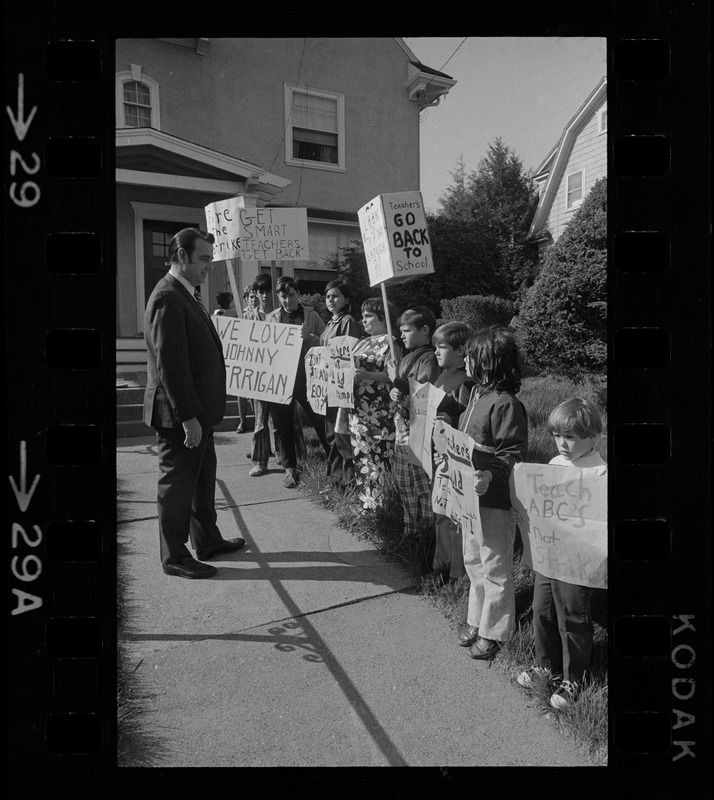 John J. Kerrigan with students picketing against teachers' strike outside his office