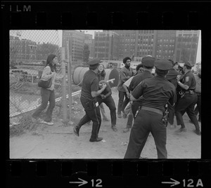 Boston police and demonstrators scuffle as arrests begin at Boston City Hospital construction site protest