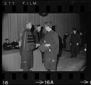At University of Massachusetts commencement in War Memorial Auditorium. From left, John W. Lederle, president, Boston Chancellor Francis L. Broderick and graduate Peter A. Bradley of Walpole