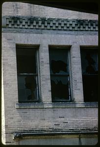 Broken windows on wall, Roxbury, Boston