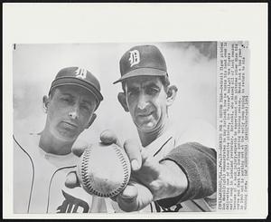 Looking For a Better Year -- Detroit Tiger pitcher Don Mossi (right) demonstrates to Ray Narleski how he turns his hand over in delivering one of his favorite pitches, the "screw" ball, at the Tigers early camp in Lakeland yesterday. Narleski, who missed all of last season because of a back injury, expects to experiment with pitches other than his curve and fast ball during spring training season. Mossi had a bad year in 1960 and is working out at the early camp hoping to return to his winning form.