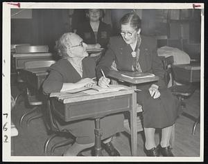 Age Is No Bar to studying when the pupils are working for their American citizenship. Mrs. Hedwig Gara, 76, at left, and Mrs. Rachel Alban, 84, help each other out in the school for DP’s conducted by the Boston Section, National Council of Jewish Women at Temple Kehillath Israel, Brooklin.