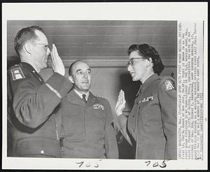 Regular Army Gets First Woman Medical Officer-First Lt. Fae M. Adams of San Jose, Calif., today is sworn in as the first woman physician to be commissioned in the U.S. regular army. Maj. Louis H. Foubare (left) of Alpena, Mich., administers the oath in the presence of Maj. Gen. George E. Armstrong, army surgeon general. Lt. Adams has been serving as a medical reserve officer since last July. During World War II she was a member of the women's army corps.