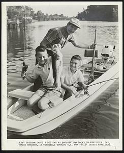 Kent Gresham lands a big one as brother Tom looks on enviously. Dad, Grits Gresham, is currently touring U.S. for ‘6-12’ insect repellent.