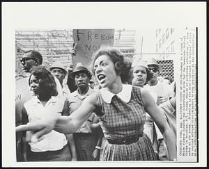 New York – Picket Shouts At Police – Woman in a group of Negro pickets outside the construction site for the Downstate Medical Center in Brooklyn, N.Y., today, shouts at policemen attempting to keep order at the scene. Picketing at the site continued in Negroes’ effort to correct alleged discriminatory hiring practices at the construction site.
